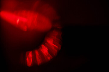 Wall Mural - red light leaks on dark background. abstract background for design with random shapes. colorful ligh