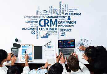 Fototapete - A diverse business team collaborates in a modern office setting, utilizing technology and data visualization to enhance customer relationship management strategies for better engagement. Amity