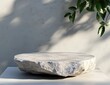 © sofia - Natural stone podium with shadow and leaves