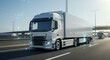 © IbragimovN - Futuristic semi truck on highway with digital graphics illustrating transport innovation