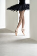 © Andriy Bezuglov/Stocksy - Ballet dancer posing inside light empty space