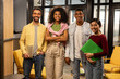 © Demetr White/Stocksy - Group of four people smiling in office