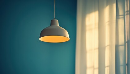 Fototapete - Modern pendant lamp illuminates a cozy room with soft light during late afternoon