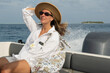 © Alina Hvostikova/Stocksy - Enjoying a sunny boat ride in a coastal paradise