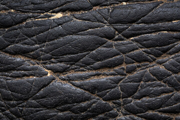 Wall Mural - black stone texture background. close up of a stone. close up of a pile of black stone. close up of 