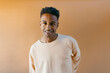 © Jimena Roquero/Stocksy - Studio portrait of young handsome man smiling at camera
