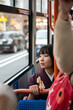 © Hernandez & Sorokina/Stocksy - Japanese woman looking through the window in the bus