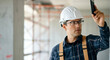 © Postmodern Studio - Caucasian male architect inspecting construction site with smartphone device