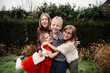 © Melissa Milis Photography/Stocksy - Christmas Cuddles Outdoors