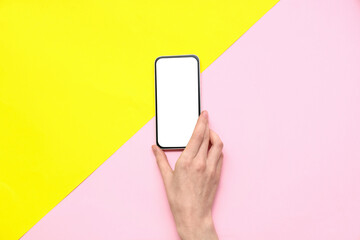 Wall Mural - female hand with mobile phone on color background