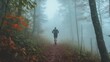 © Muhbahrir ghozali - Trail runner disappearing into the dense fog of a forest path adventure