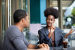 © Jovo Jovanovic/Stocksy - Confident businesswoman explaining colleague at cafe