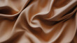 © Curioso.Photography - Close-up shot of smooth beige fabric with soft folds, highlighting the texture and shine of the material.