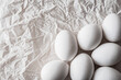 © Anna - White eggs arranged on crumpled paper, creating a clean and organic composition. Soft natural light enhances textures, making it ideal for Easter, minimal food photography, and rustic design concepts