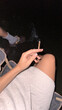 © Alina Hvostikova/Stocksy - Relaxing evening with a smoke on the beach