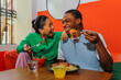 © BONNINSTUDIO/Stocksy - Couple enjoying a delicious pasta and salad together at restaurant
