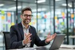 © PlanetOfVectors - Smiling businessman wearing glasses sitting at desk with laptop, gesturing while discussing ideas in modern office with sticky notes on glass wall. Ai generative