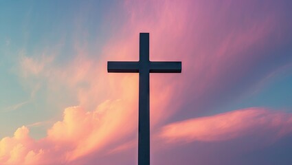Poster - Christian cross silhouette against a vibrant sunset sky with pink and blue hues, centered for copy space and design elements.