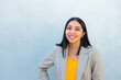 © Dani Nahuel/Stocksy - Young latin professional woman smiling