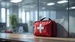 © rosen thal - First aid kit in office, symbolizing workplace safety, health, and emergency preparedness