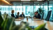 © Fotograf - A group of professionals gathered around a conference table for a meeting