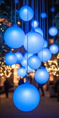 Wall Mural - festive blue hanging globes, festive illumination, blue glowing spheres, art installation