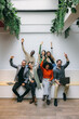 © VICTOR TORRES/Stocksy - Diverse team celebrating success in modern workspace