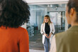 © VICTOR TORRES/Stocksy - Team meeting in modern office with diverse professionals