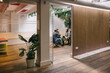 © VICTOR TORRES/Stocksy - Modern office meeting space with vibrant decor and plants
