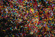 © Yakov Knyazev/Stocksy - Multicolored confetti scattered on the ground