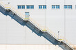 © Lawren Lu/Stocksy - Industrial Staircase with Geometric Shadows on Building