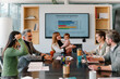 © VICTOR TORRES/Stocksy - Business meeting room with team collaboration and presentation