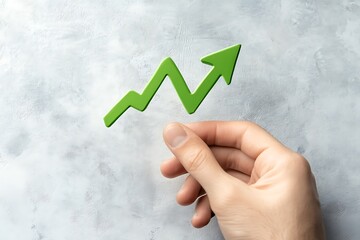 Wall Mural - hand holding business increases in the financial graph arrow. business collage