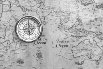 Wall Mural - classic round compass on background of old vintage map of world
