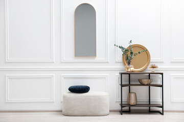 Poster - Console table with decor, pouf and mirror in room. Interior design