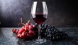 © Photo by mQ - A glass of red wine surrounded by grapes, set against a dark marble surface, creating a luxurious and elegant atmosphere