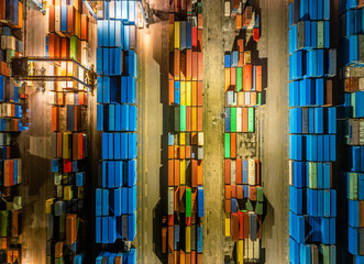 Aufkleber - Aerial view of stacked shipping containers at night