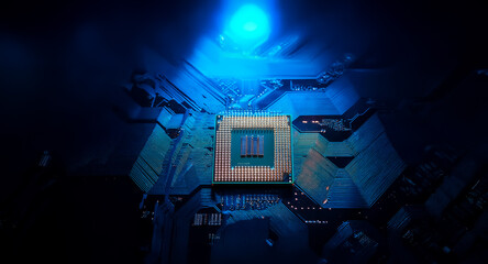 Poster - A detailed view of a golden CPU chip on a dark blue circuit board, brightly illuminated by a cool blue light source, emphasizing modern technology and complex electronics.