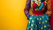 © Ceyhun - A circus performer's costume with bright patterns on a plain red and yellow background