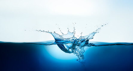 Leinwandbilder - A vibrant blue water splash erupts upwards from the water's surface, creating a dynamic burst.  The bright light enhances the refreshing and pure essence of the liquid motion.