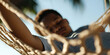 © Lila Patel - Young Person in Hammock, Outdoor Setting