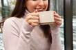 © New Africa - Smiling woman having coffee break in cafe, closeup