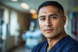 © NicotineLens  - Confident Male Doctor or Nurse in Hospital Corridor