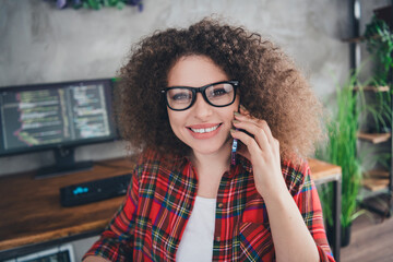 Young professional programmer working remotely in a stylish home office environment