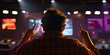 © Lila Patel - Person Gesturing at Screen in Dimly Lit Room