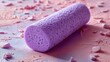 © Firadoaw - A soft purple foam roller, a tool for both exercise and relaxation, lay on a pastel backdrop, promising relief and rejuvenation for the body and mind.