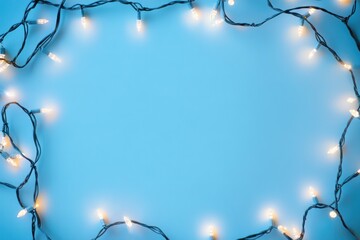 Wall Mural - christmas string lights with a soft glowing effect arranged in a circular pattern over a tranquil bl