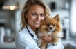 © yevgeniya131988 - Beautiful middle-aged female doctor with a fluffy dog in her arms