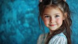 Adorable Little Girl Portrait Against Teal Background