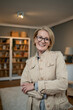 © Migma_Agency - Portrait of a mature woman in a jacket with crossed arms